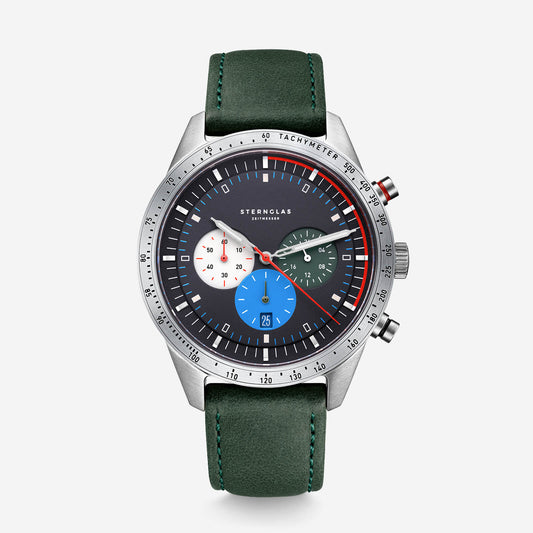 popup|Sporty design in detail|We manufacture the dial alone from 29 individual parts. The tachymeter scale and colored highlights are inspired by the cockpit of a sports car.